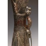 PNG, Lower Sepik, hourglass-shaped drum, the handle on both sides decoratedwith an anthropomorphic