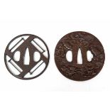 Japan, twee tsuba's, Edo Periode,een ajour met geometrisch patroon, gesigneerd Efiyu Akao