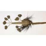 PNG, headhunters emblem, swordfish bone, casuary feathers, coix seeds and nut cases; l. 62,5 cm;