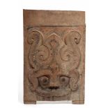 Sumatra, Toba Batak, wooden rectangular architectural pannel decorated with a Singa headtraces of