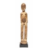 Burkina Faso, Lobi, standing male figure, bateba;red collored hard wooden figure standing on high