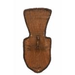 Chad, Logone, wicker shield, marayada;curved shield with bound wooden grip. rattan, leather and