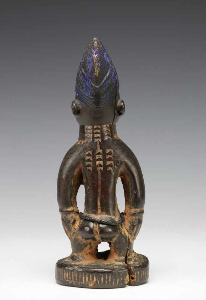 Yoruba, standing female Ibeji figurewith rows of scarifications on the body and brown to black - Image 3 of 5