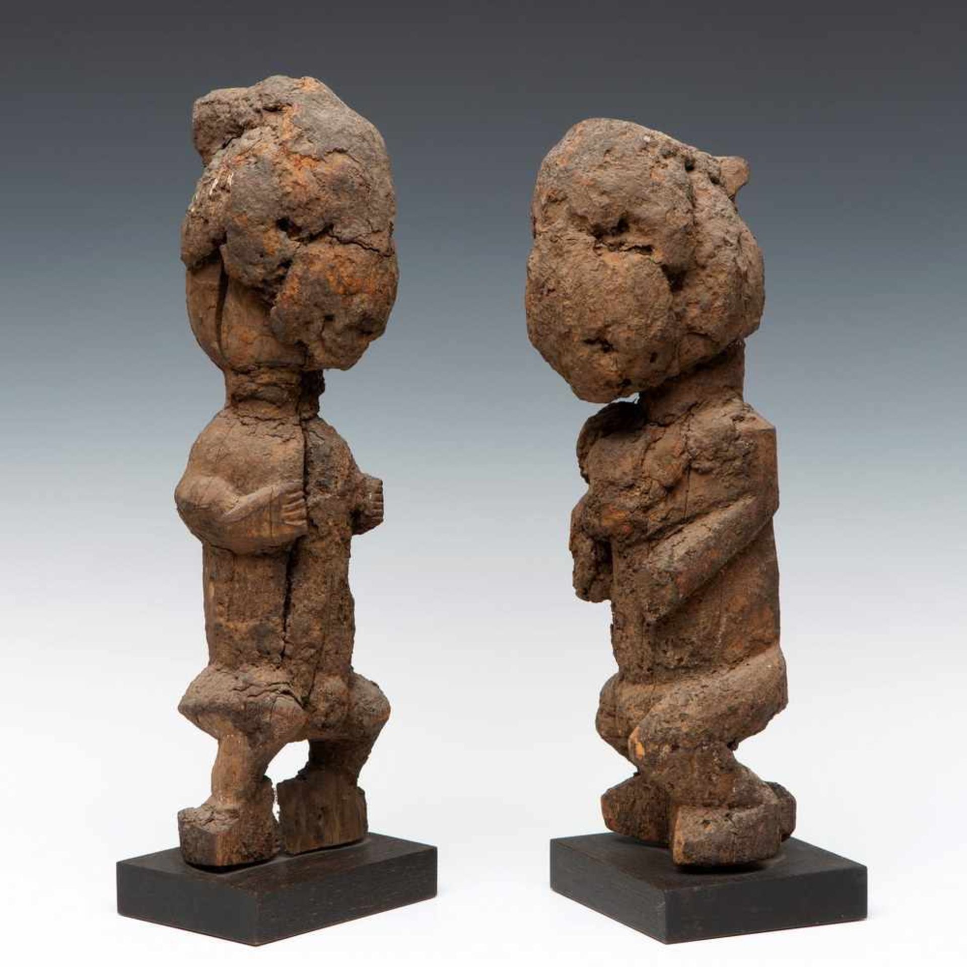 Nigeria, pair of ancestral figures,two carved wooden figure with accents on the temples,
