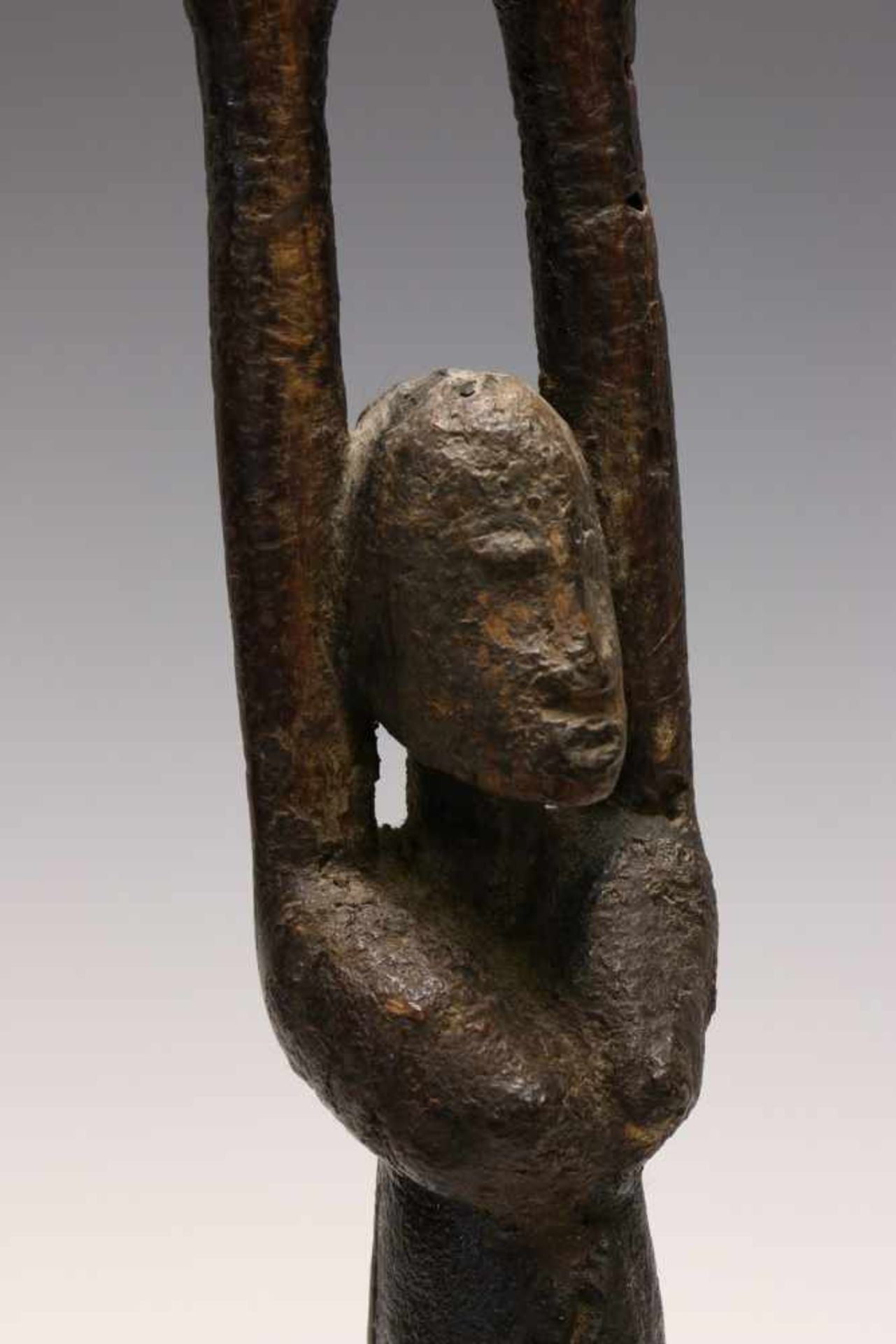 Dogon, standing antropomorphic figure,with raised arms and dark oily patina. Provenance, Steven de
