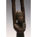 Dogon, standing antropomorphic figure,with raised arms and dark oily patina. Provenance, Steven de