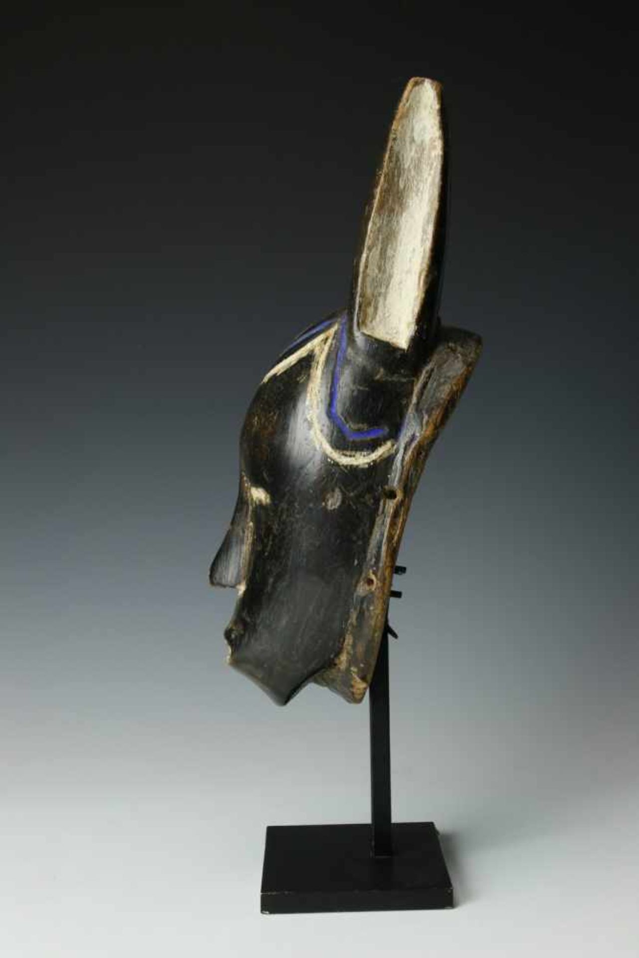 Ivory Coast, Guro, face mask,with straight horns, engraved hairline with accents in blue and
