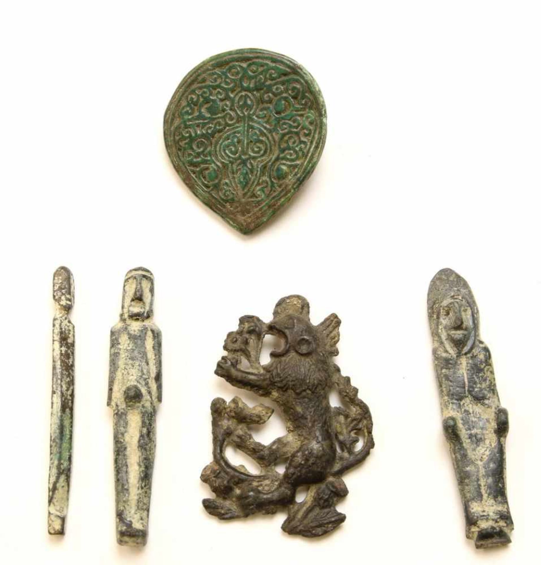 Three metal small anthropomorphic figures and two antique amulets;one amulet of Islamic origin,