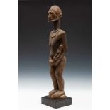 Mali, Dogon, N'Duleri, standing female figure with child,grayish-black color with traces of