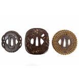 Japan drie tsuba's, Edo periode,een ronde tsuba in de stijl van gevlochten rotan, een met reliëf