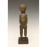 Ivory Coast, Baule, standing figure,with layers of offering and various scarifications on the