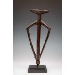 Burkina Faso, Mossi, large wooden flutein a stylized anthropomorphic shape. With dark brown to black