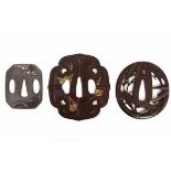 Japan, drie tsuba's Edo periode,een ajour in vorm van bamboe, een tsuba in bladvorm met versieringen