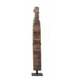 Borneo, Bahau, carved wooden ladderwith at the top a carved decorative ending with an animal.