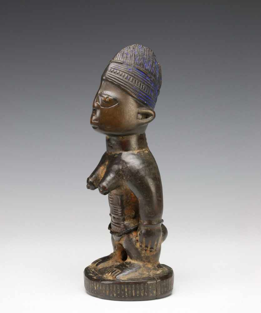 Yoruba, standing female Ibeji figurewith rows of scarifications on the body and brown to black - Image 2 of 5