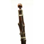 DRC. Luba, dignitary staff;wooden carved branche surmounted by a janus buste. With aluminium plating
