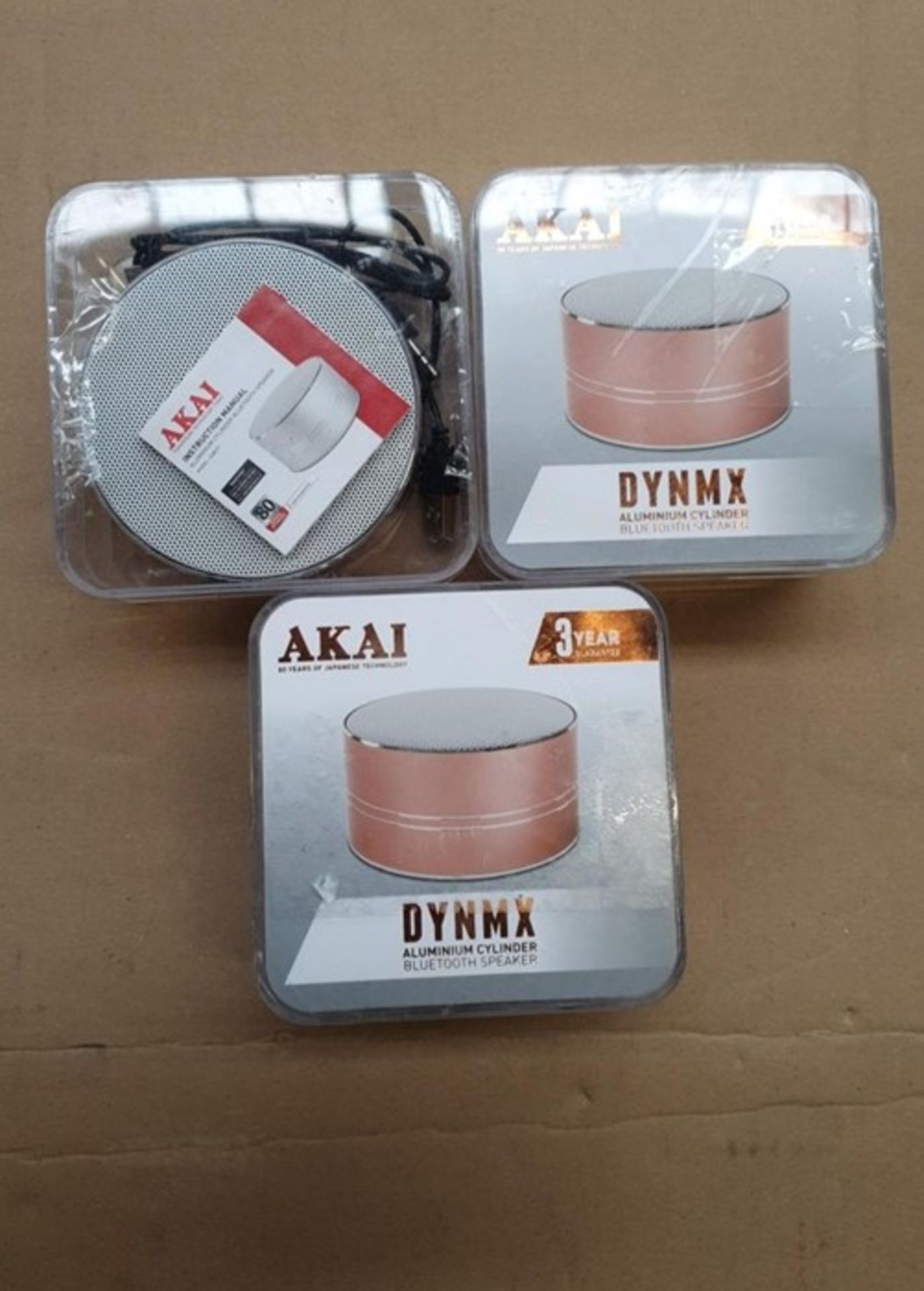 1 LOT TO CONTAIN 3 AKAI DYNMX ALUMINIUM CYLINDER BLUETOOTH SPEAKERS ROSE GOLD / BL -5615 / RRP £45.