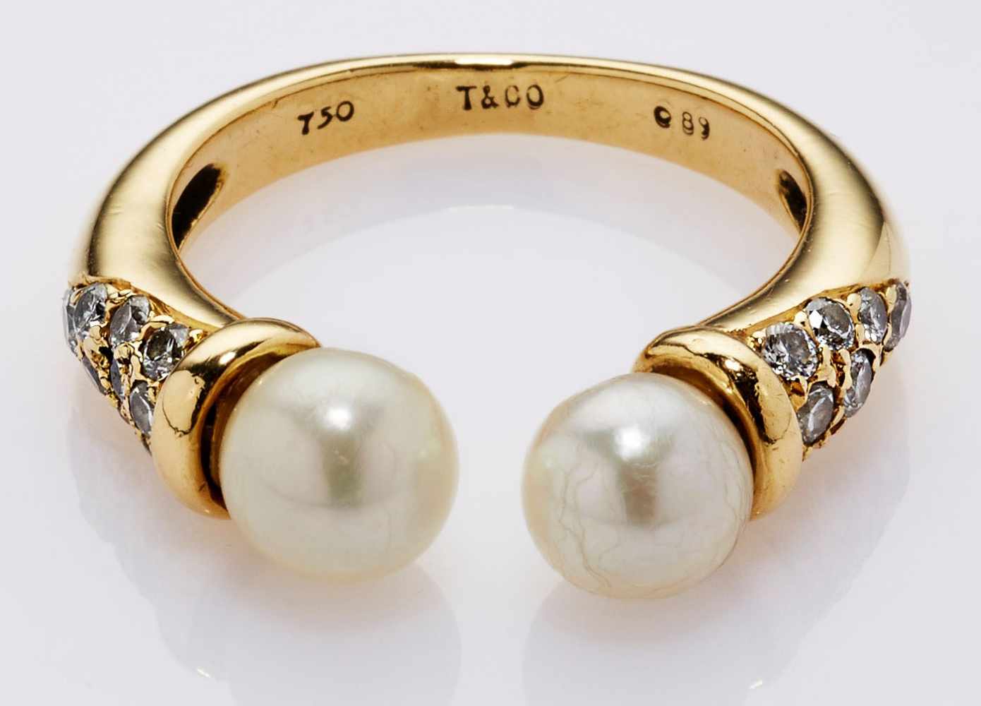 Vintage-Ring Tiffany & Co.18 kt GG, offener Ring besetzt mit 18 Brillanten von zus. ca. 0,89 ct