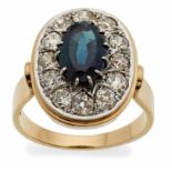 Saphir-Diamant-Ring um 1920.14 kt GG/WG, ovale Platte besetzt mit 1 dunkelblauen Saphir im