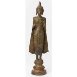 Stehender Buddha, wohl Thailand 19. Jh.Bronze m. Resten v. Bemalung. In Mantel, beide Hände erhoben,