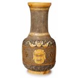 Vase mit Masken, China wohl um 1900.Elfenbein, vollrd. geschnitzt, partiell geschwärzt. Kugelige