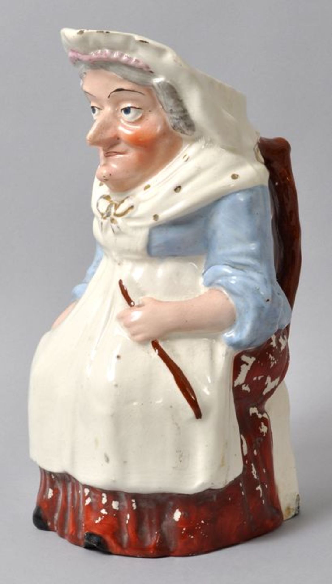 Figurenkrug/ Toby jug Judy, Staffordshire, 19. Jh.Steingut, polychrom bemalt, sparsame Goldhöhungen.