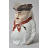 Figurenkrug/ charakter jug, England (?), 19. Jh.Porzellan, polychrom bemalt. Figur eines