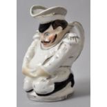 Figurenkrug/ Toby jug, England (?), 19. Jh.Porzellan, sparsam polychrom bemalt mit Silberhöhungen.