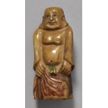 Netsuke, Japan, 20. Jh.Elfenbein, partiell farbig gefasst, dunkle Patina. Figur des Glücksgottes