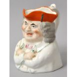 Kleiner Figurenkrug/ character jug, England (?), 19. Jh.Porzellan, polychrom bemalt, Halbfigur eines
