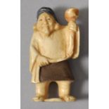 Netsuke, Japan, wohl Anf. 20. Jh.Elfenbein, geschnitzt, partiell farbig gefasst. Figur eines