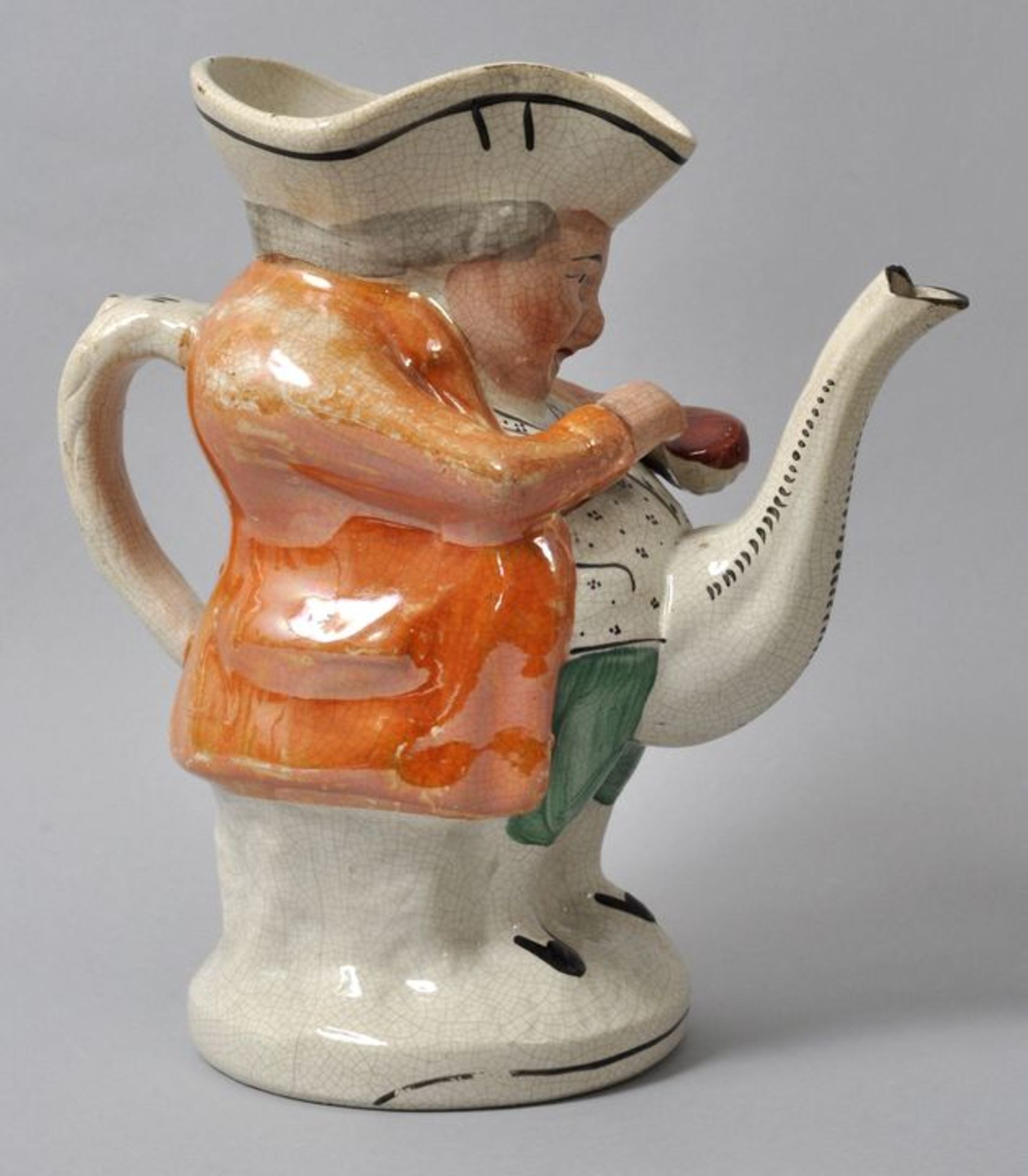 Figurenteekanne/ Toby tea pot, 2. H. 19. Jh.Steingut, polychrome Bemalung, teils Lüsterbemalung. - Image 2 of 2