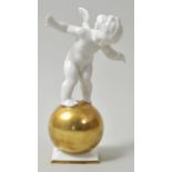 Putto auf Weltkugel, Selb, L. Hutschenreuther, ca. 1920/ 30.Entw. Karl Tutter. Porzellan, weiß-gold.