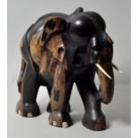 Afrika. Elefant.Ebenholz, geschnitzt, Bein. Große figürliche Darstellung eines schreitenden