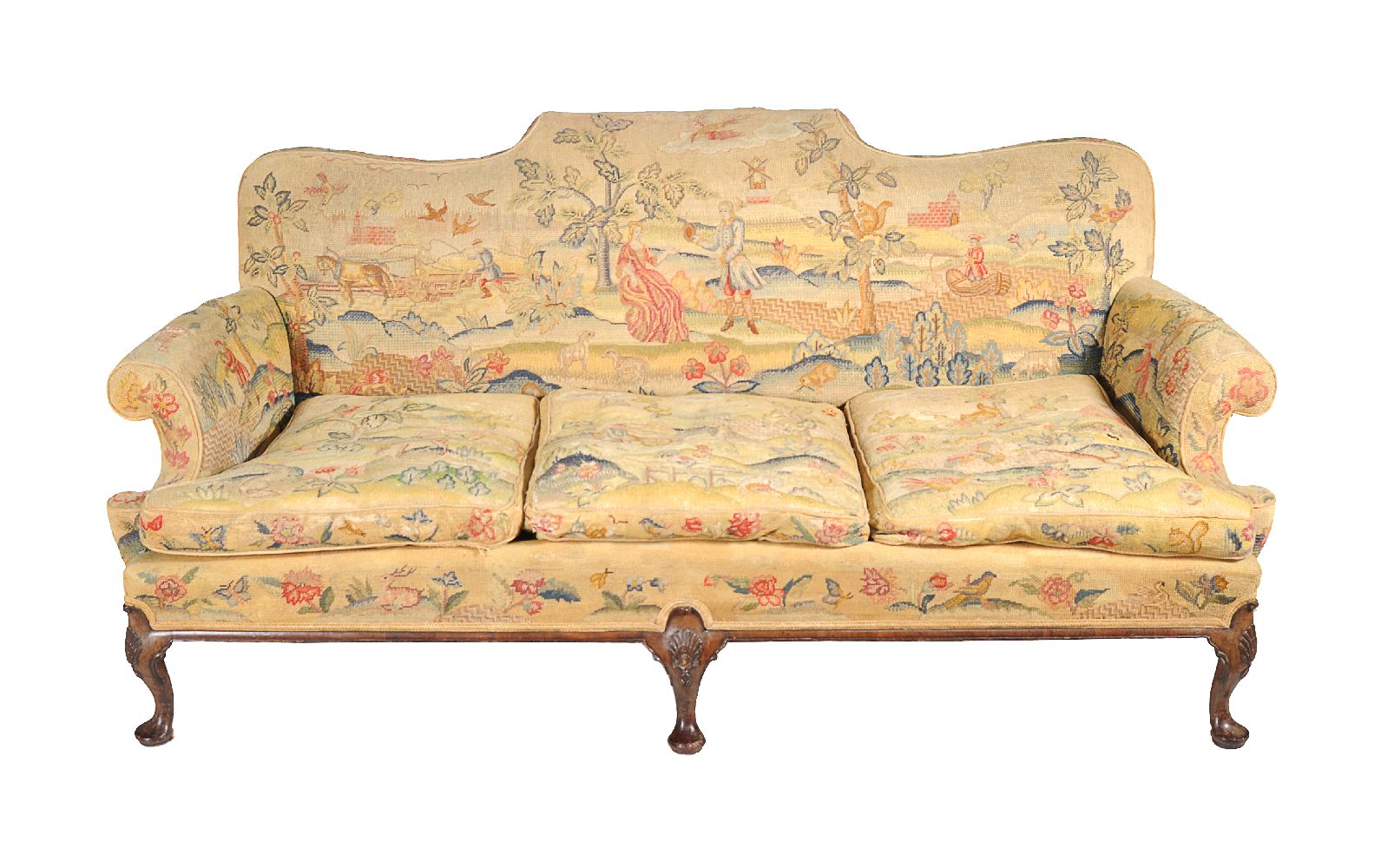 A carved walnut and woolwork upholstered sofa in Queen Anne style, late 19th century