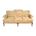 A carved walnut and woolwork upholstered sofa in Queen Anne style, late 19th century