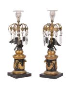 A pair of cut glass and patinated and parcel gilt bronze lustre candlesticks in Regency taste, early