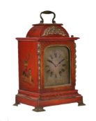 A red lacquer table clock in mid-18th century style