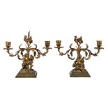 A pair of gilt metal twin light figural candelabra in Louis XV style, mid-19th century