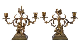 A pair of gilt metal twin light figural candelabra in Louis XV style, mid-19th century
