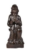 A Continental carved and stained wood figure of a kneeling penitent, 18th century