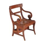 A mahogany metamorphic library armchair, early 20th century