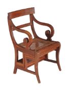A mahogany metamorphic library armchair, early 20th century