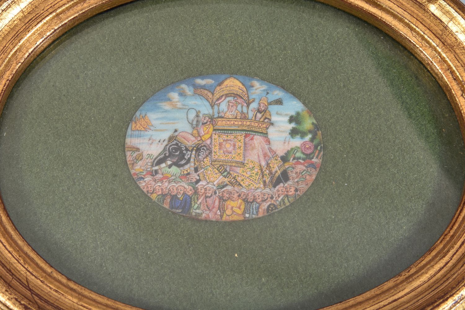 ϒ An Indian oval miniature, with views of the Taj Mahal - Image 2 of 3