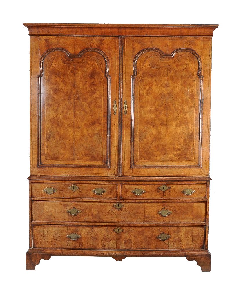 A walnut and feather banded press cupboard, circa 1730