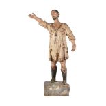 A Spanish carved and polychrome painted wood model of a man