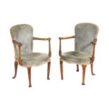 A pair of George I walnut and upholstered armchairs, early 18th century