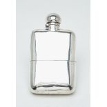 A Victorian silver rounded rectangular spirit flask by The Goldsmiths & Silversmiths Co. Ltd