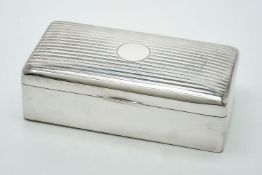A silver rectangular cigarette box by Charles S Green & Co Ltd