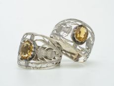 [Scottish market] A pair of silver and citrine D-section napkin rings by Joseph Cook & Son